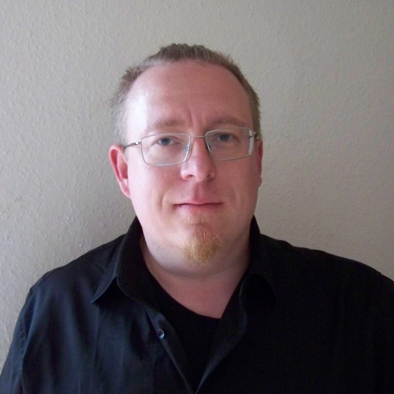 Bild von Christian Heep man mit kurzen Haaren, Brille und Bart